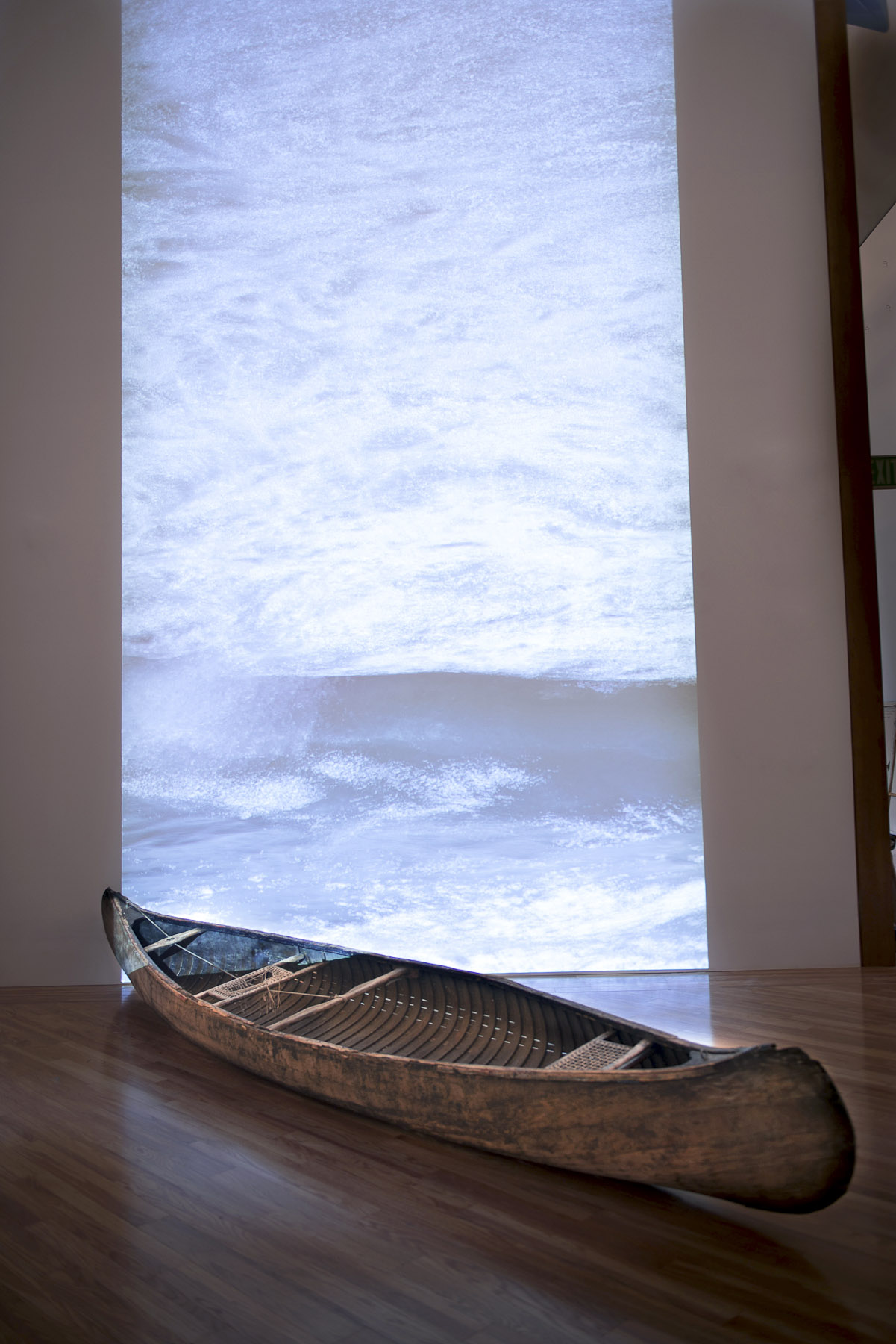 Tracind Antilles, 2013, Installation, Wooden Canoe, and video projection. Dimentions: variable. The Patricia and Phillips Frost Museum, Miami, FL.